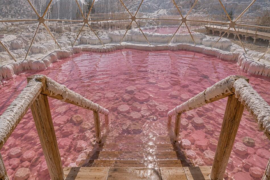 Rendering of the pink soaking pool beneath a geodesic dome