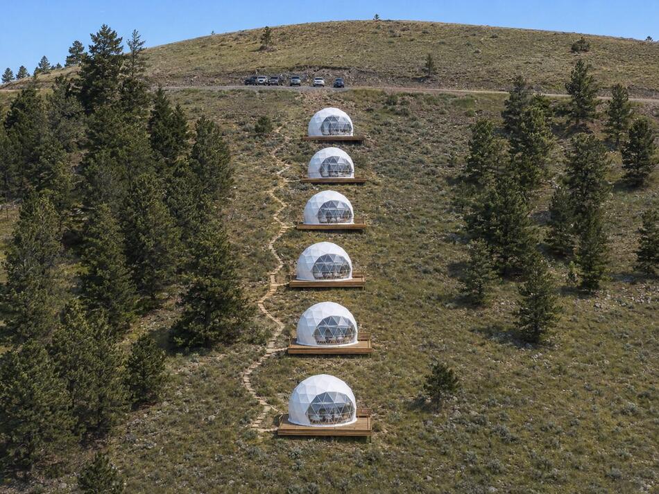 Rendering of glamping domes on the hillside